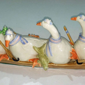 4 geese rowing, ceramic.