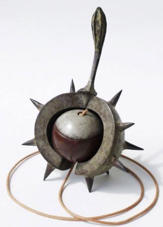 Conker in shell with string attached, bronze.