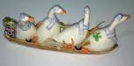 4 geese rowing, rear view, ceramic.